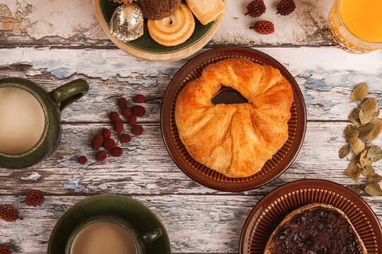 Cozy breakfast setup with pastries and beverages