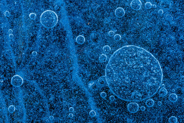 Top view of Blue bubbles under frozen water surface