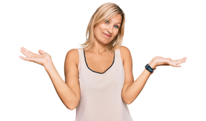 Middle age caucasian woman wearing casual clothes clueless and confused expression with arms and hands raised. doubt concept.
