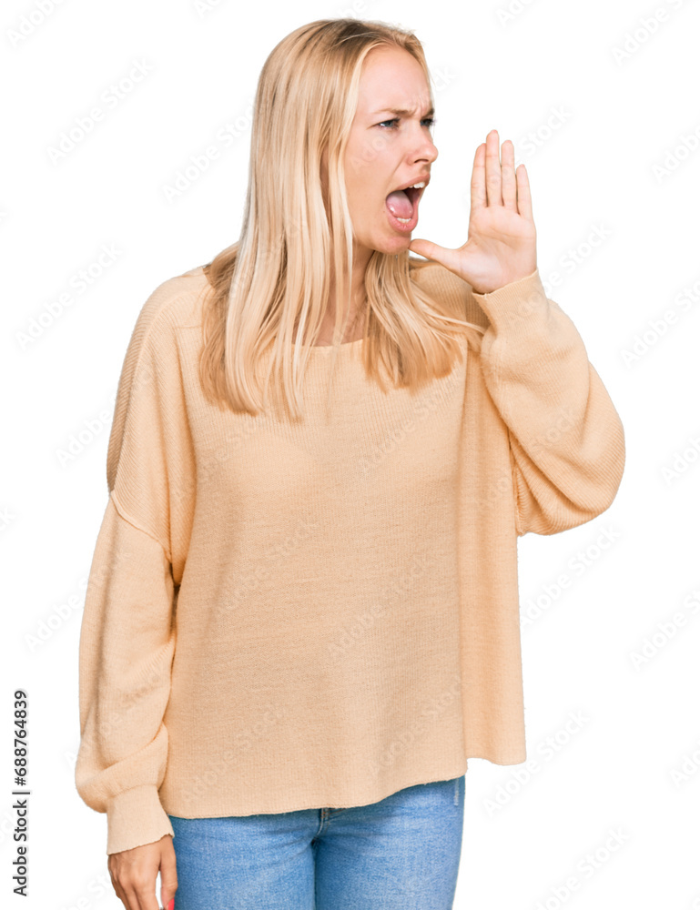 Sticker Young blonde girl wearing casual clothes shouting and screaming loud to side with hand on mouth. communication concept.