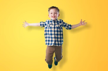 Photo of cool school boy posing on color background