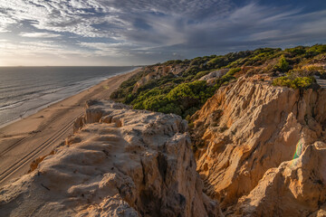 El Arenosillo beach is characterized by being a virgin beach of fine, golden sand. Its cliffs make it unique. Pure nature, full of pine trees and native vegetation. One of the best beaches in Spain.