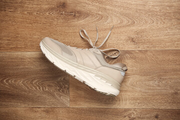 Sports sneakers on wooden floor. Top view