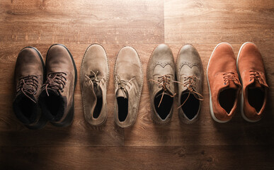 Four pairs of men's casual shoes on the floor