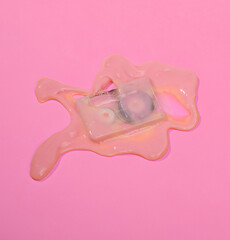 Creative layout with audio cassette in slame on bright pink background. Visual summer trend. Minimalistic retro 80s aesthetic still life with shadow. Fresh idea
