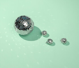 Creative minimal still life with mirrored disco balls on blue background. Party concept. visual...