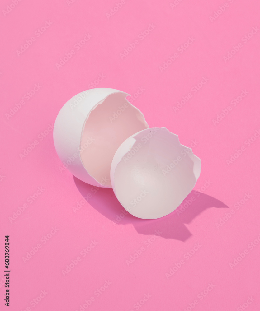 Poster creative layout with broken chicken egg shell. bright pink background with shadow. visual trend. eas
