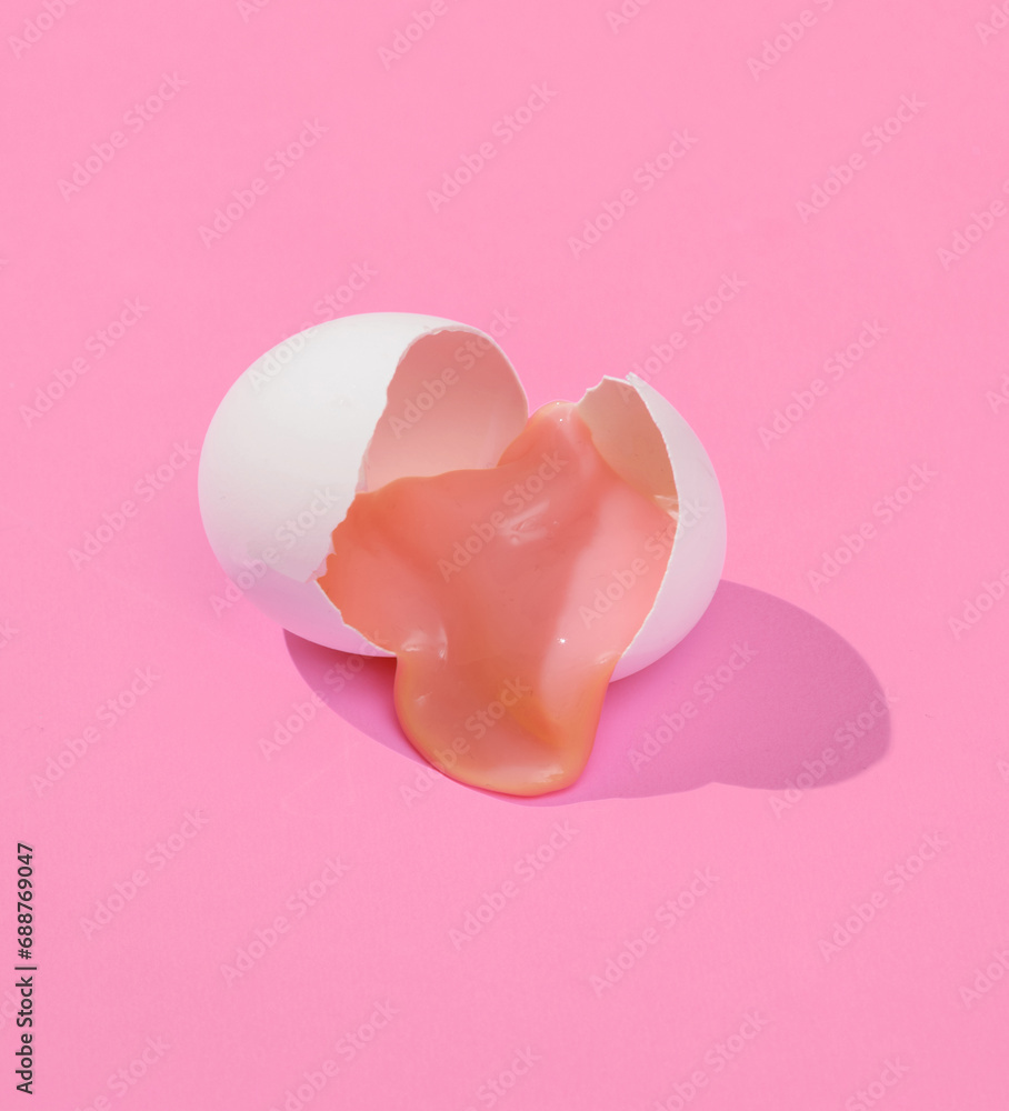 Aufkleber creative layout with slime in broken chicken egg shell. bright pink background with shadow. visual t