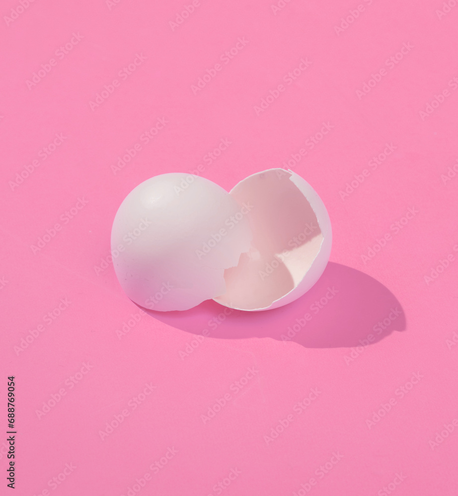 Poster creative layout with broken chicken egg shell. bright pink background with shadow. visual trend. eas
