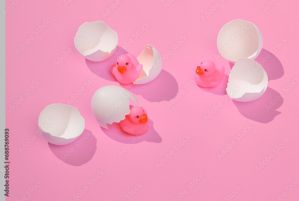 Poster creative layout with hatched ducklings from eggs. bright pink background with shadow. visual trend. 