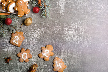Gingerbread cookies of the form of numbers and 2024. Christmas composition with gingerbread on gray...