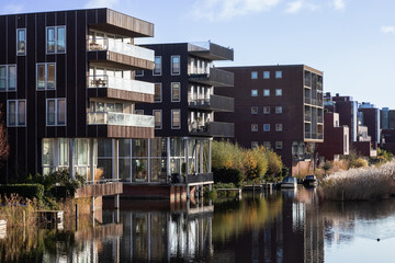 Modern residential buildings along the water in the new IJburg district in Amsterdam.