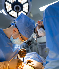 Two surgeons performing surgery on a patient in a hospital. Two Surgeons Performing Neurosurgery in a Modern Hospital