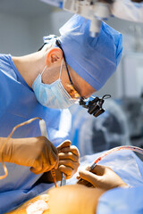 A surgeon is performing surgery on a patient. A Skilled Surgeon Performing Neurosurgery