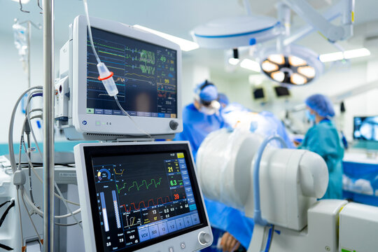 A Hospital Room With Monitors And Medical Equipment. A Modern Hospital Room With Advanced Medical Equipment