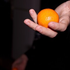 orange in hand