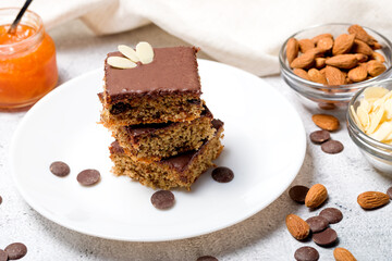 Chocolate almond dough. Traditional chocolate dough decorated with almond flakes