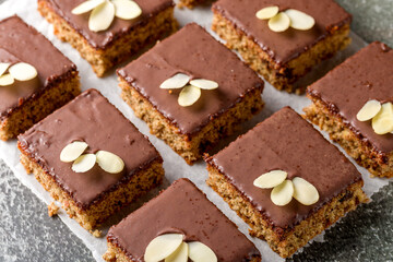Chocolate almond dough. Traditional chocolate dough decorated with almond flakes