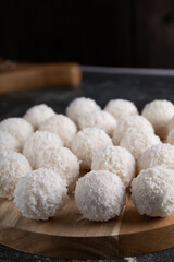 Fototapeta na wymiar This closeup photo of gourmet confectionery—a group of homemade coconut candy balls. With a tempting mix of sweetness and round perfection, these treats make for a delightful dessert gift.