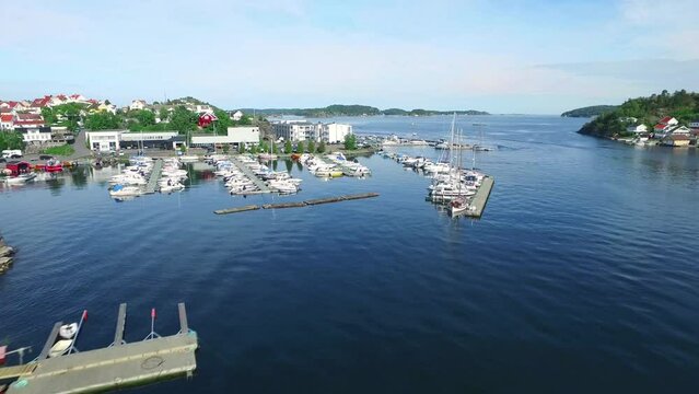 Drone, harbor and boat on beach with landscape, scenery and nature background for location or holiday. Aerial view, ocean and water transportation for travel, vacation or coastal island in Norway