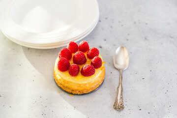 Mini cheesecake with raspberries close-up. Homemade delicious dessert - Powered by Adobe