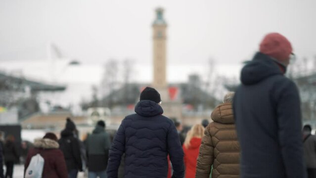 Fans approaching a stadium for a football game during winter in Leipzig, Germany