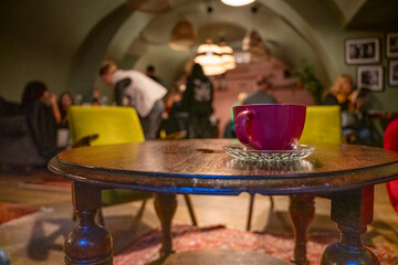 Purple Coffee Cup wait in store with warm color environment