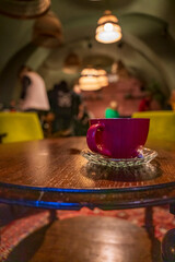 Purple Coffee Cup wait in store with warm color environment