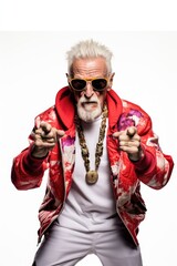 Stylish older man in modern rapper clothes and white hair pointing at the camera on a white background