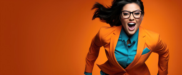 stylish businesswoman in a suit and glasses running to success, orange banner with copy space - obrazy, fototapety, plakaty