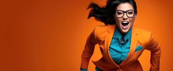 Foto op Plexiglas stylish businesswoman in a suit and glasses running to success, orange banner with copy space © aninna