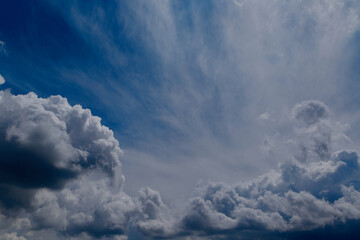 Cumulus clouds in the blue sky close-up, among the clouds
