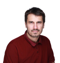 Obraz premium A picture of a man with a beard, mustache and fashionable hairstyle, dressed in a casual polo shirt, posing in a studio with a serious expression on a light background