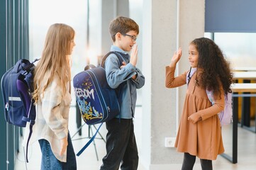 Group of elementary school kids in a school corridor