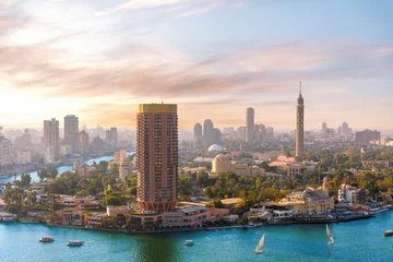 Schilderijen op glas Gezira island on the Nile at sunset, exclusive aerial view of Cairo, Egypt © AlexAnton