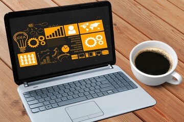 Laptop computer with blank screen on office desk