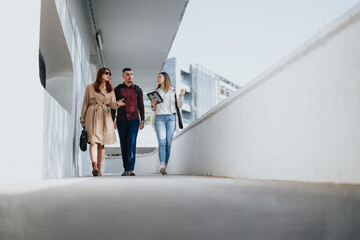 Young business people in the city collaborating on innovative ideas for their start-up, focusing on digital marketing and e-commerce.