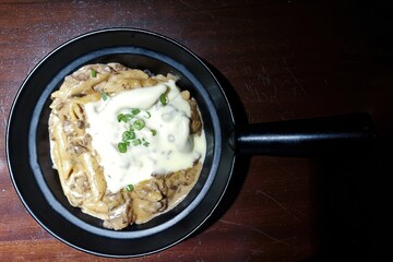 Steak pasta with cheese on table. selective focus.