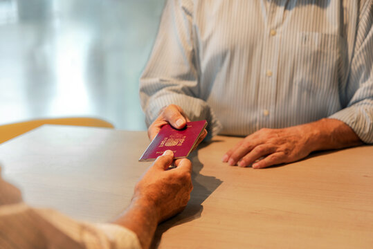 Senior man with passport on check-in