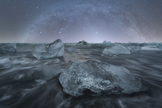 Majestic Icebergs Under The Night Sky At Diamond Beach