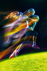 American football player in motion during game, running with ball over dark background in neon mixed light. Burning ball. Concept of sport event, 2024 championship, betting, game. Poster for ad