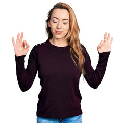 Young caucasian woman wearing casual clothes relax and smiling with eyes closed doing meditation gesture with fingers. yoga concept.