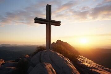 A cross standing tall on top of a mountain, illuminated by the warm colors of a beautiful sunset. Perfect for religious themes and inspirational concepts - obrazy, fototapety, plakaty