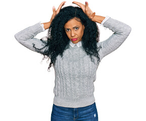 Middle age african american woman wearing casual clothes doing bunny ears gesture with hands palms...