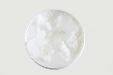 Fototapeta na wymiar organic coconut cream oil in jar in white background,top view