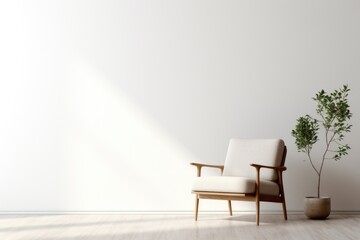 A white chair sitting next to a plant in a room. This picture can be used to depict interior design or create a cozy atmosphere