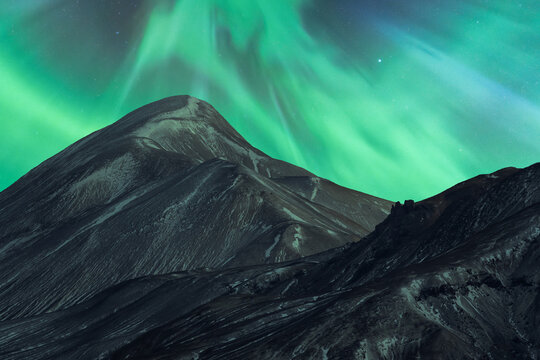 Northern lights over a majestic mountain in Iceland