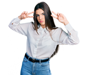 Young brunette teenager doing peace gesture close to eyes depressed and worry for distress, crying angry and afraid. sad expression.