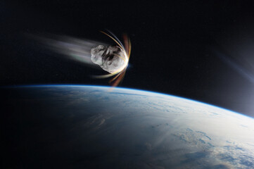 Earth planet and asteroid in outer space. Meteorite in outer space near Earth planet. Elements of this image furnished by NASA.