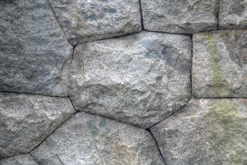 Boulders and mortal stone wall background